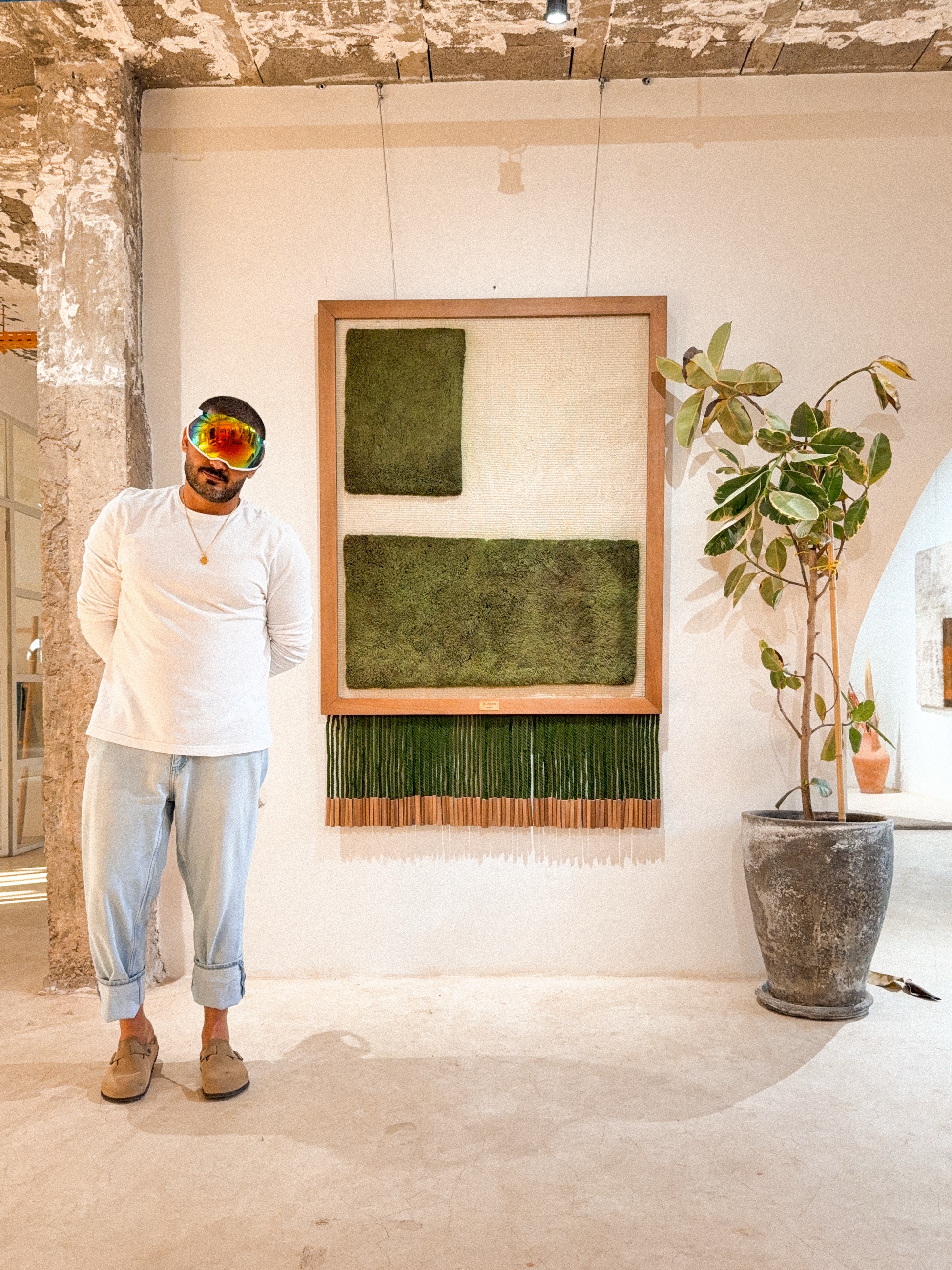 NICH, the artist, beside a Circuits work in the atelier